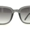 Vista frontal del lente de sol Guess AC negro transparente forma rectangular medida 53 20 150