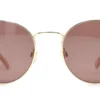 Vista frontal del lente de sol Levis metal dorado forma redonda medida 52 21 145